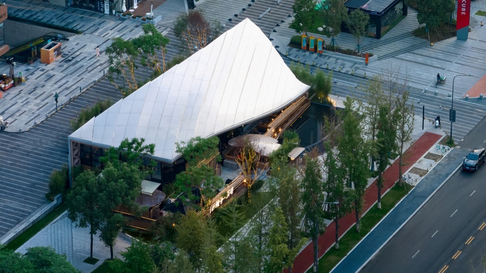 Timber Roofed Restaurant on Jiaozi Avenue China by BEHIVE Architects