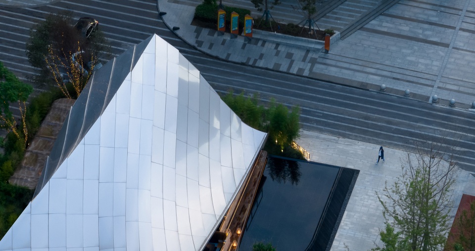 Timber Roofed Restaurant on Jiaozi Avenue China by BEHIVE Architects