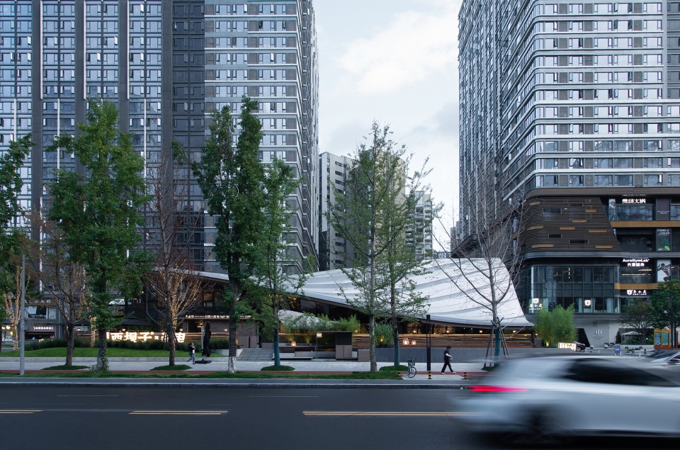 Timber Roofed Restaurant on Jiaozi Avenue China by BEHIVE Architects
