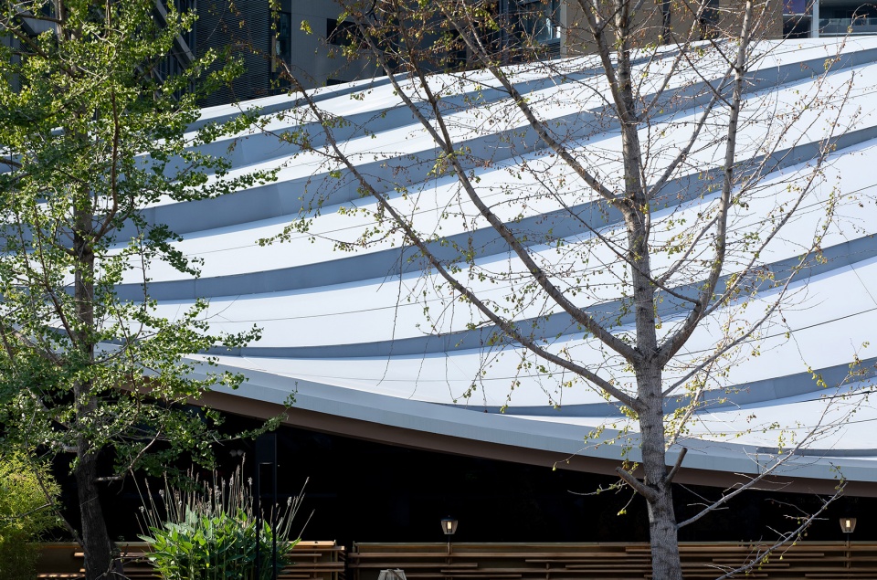 Timber Roofed Restaurant on Jiaozi Avenue China by BEHIVE Architects