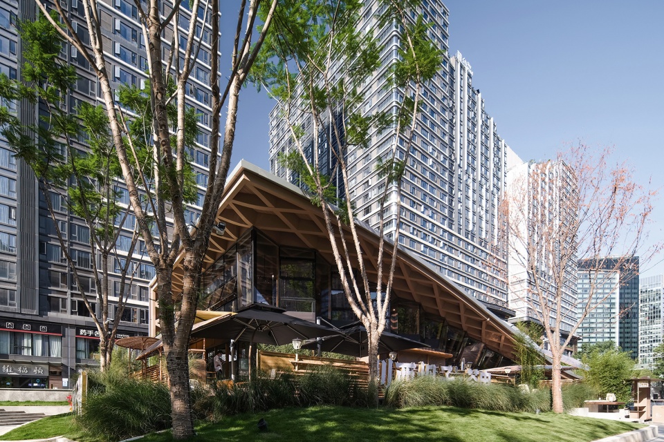 Timber Roofed Restaurant on Jiaozi Avenue China by BEHIVE Architects