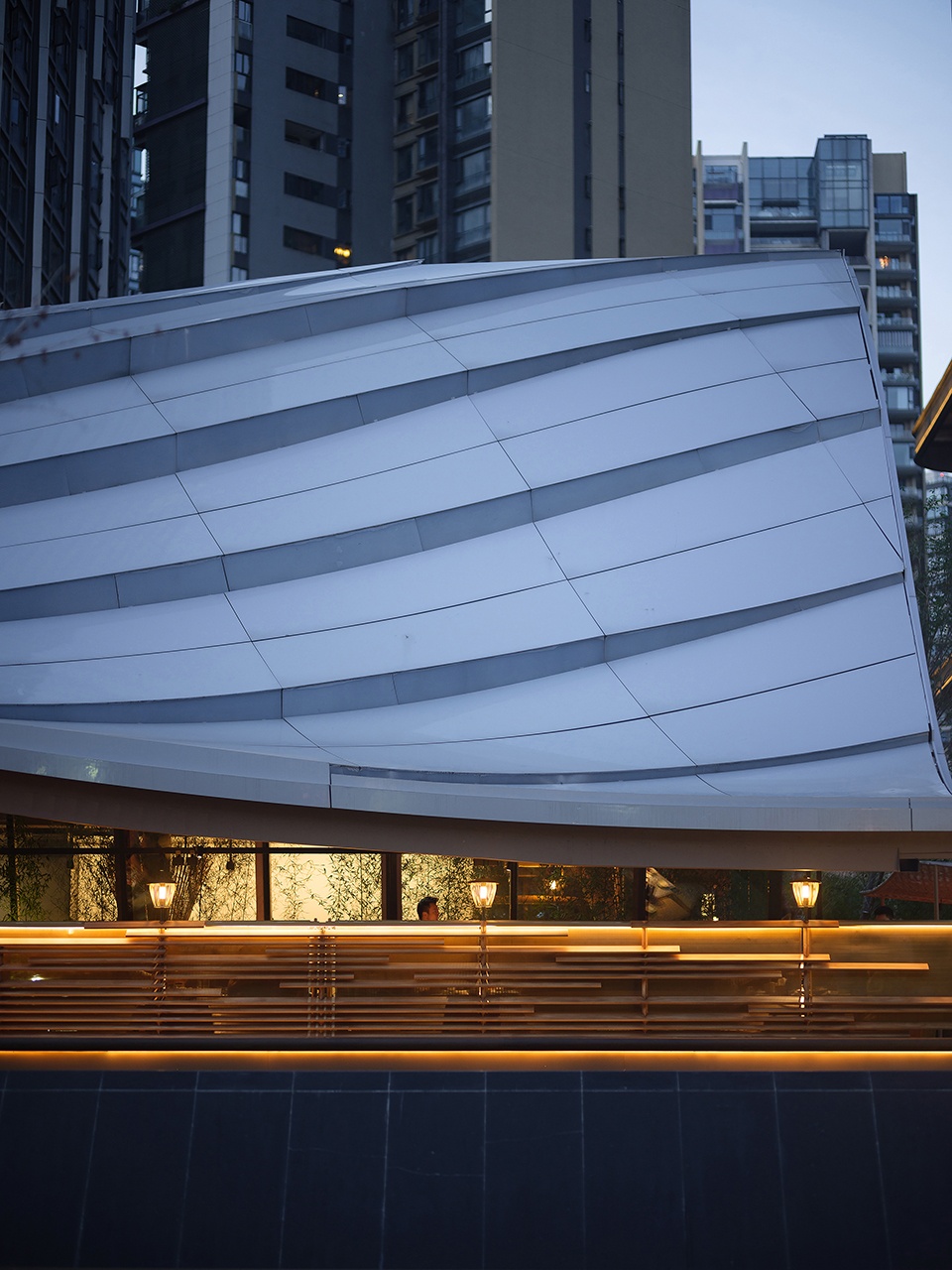 Timber Roofed Restaurant on Jiaozi Avenue China by BEHIVE Architects