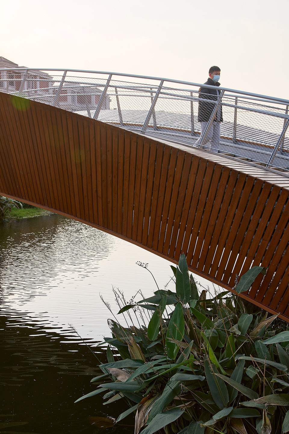 a leaf of boat the reconstruction of a convenient bridge in new jiangwan neighborhood shanghai by l and m