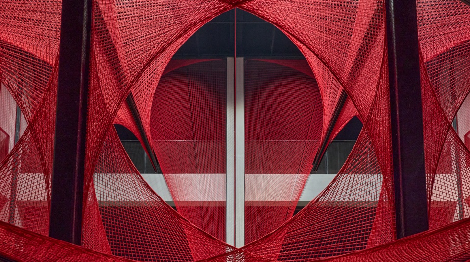 the flower of tujia at the china tujia brocade art museum by yimu design office