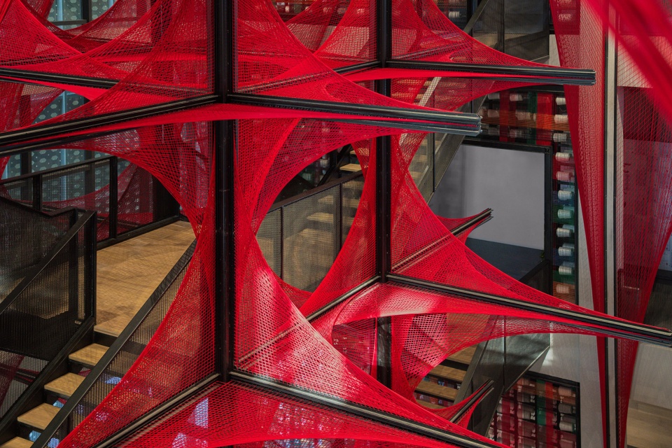 the flower of tujia at the china tujia brocade art museum by yimu design office