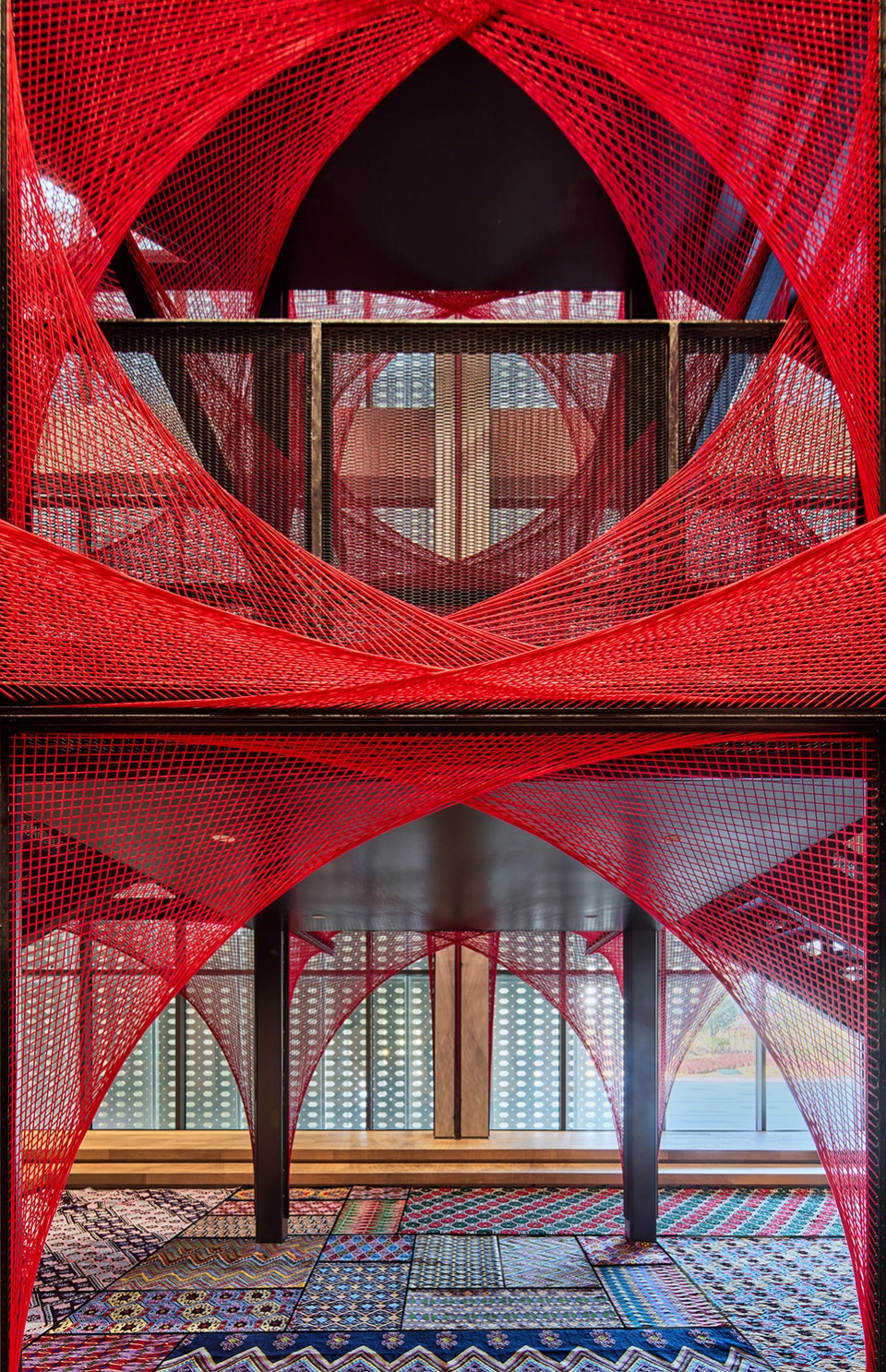 the flower of tujia at the china tujia brocade art museum by yimu design office