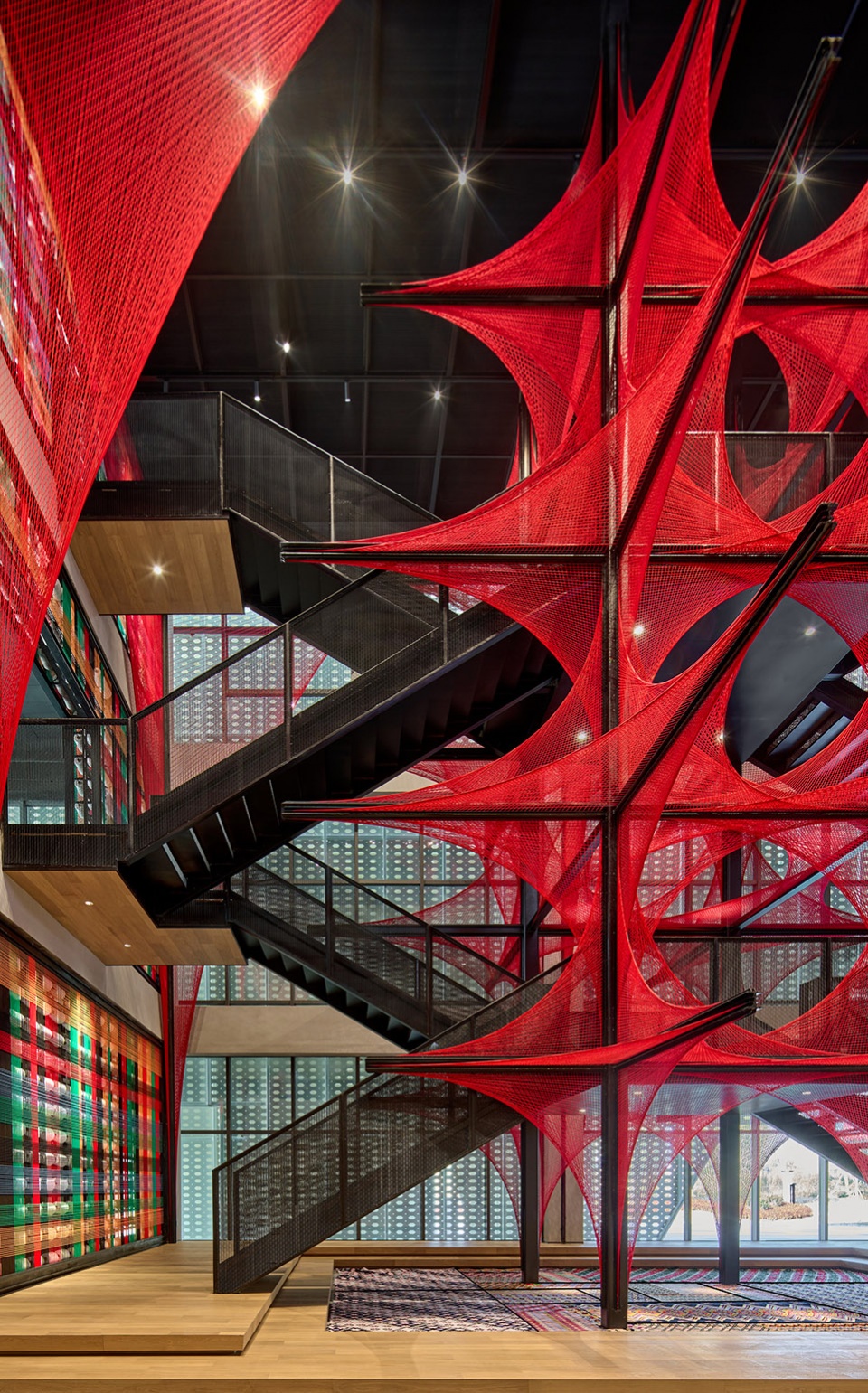 the flower of tujia at the china tujia brocade art museum by yimu design office