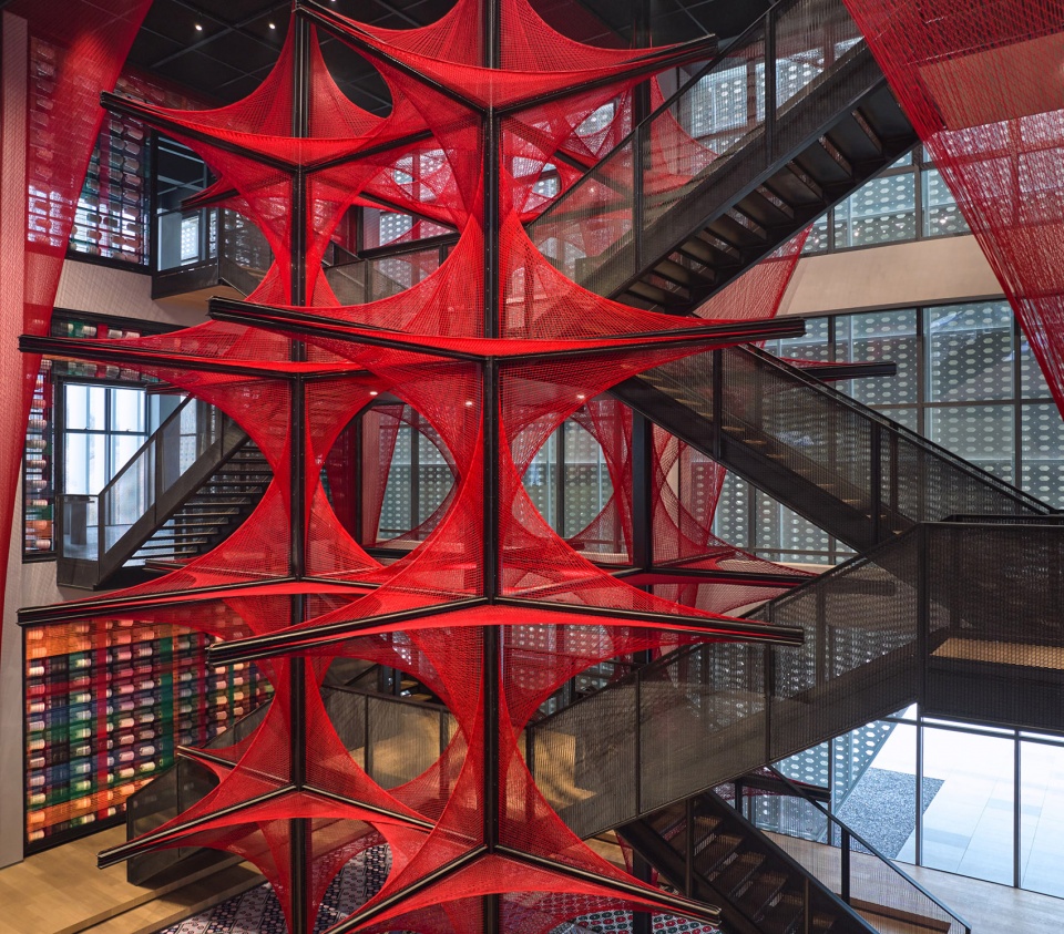 the flower of tujia at the china tujia brocade art museum by yimu design office