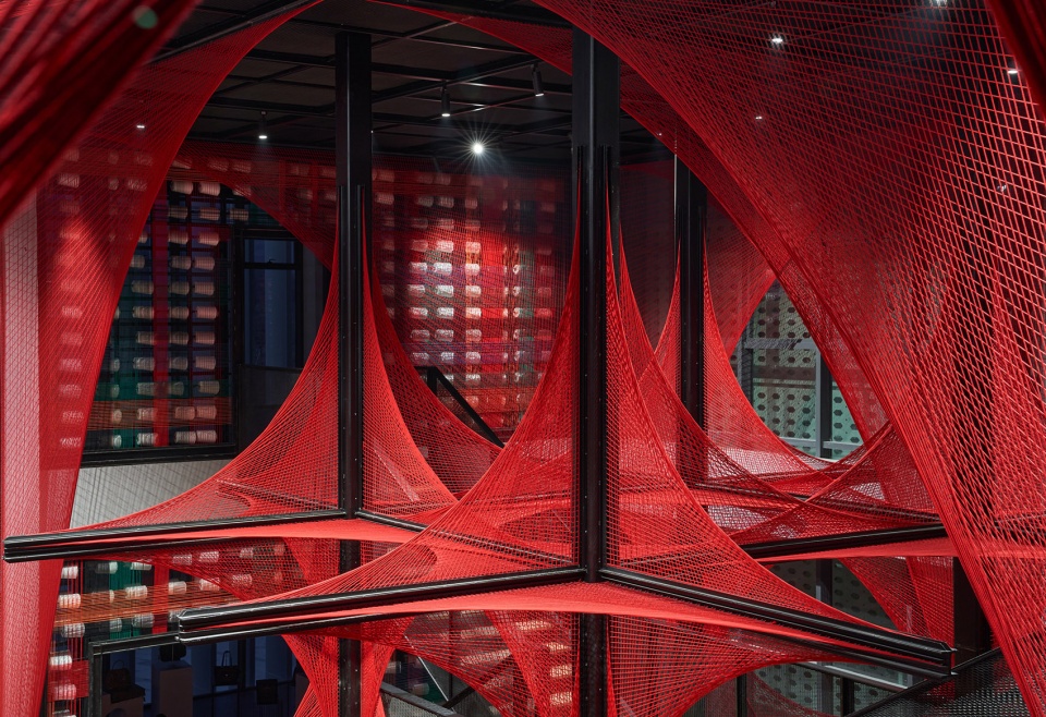 the flower of tujia at the china tujia brocade art museum by yimu design office