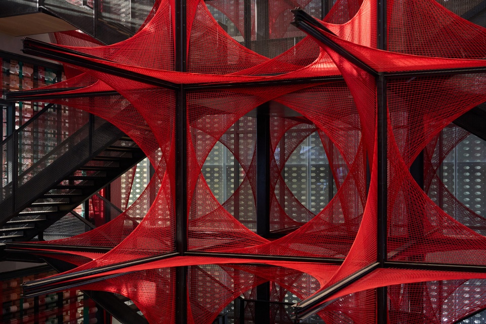 the flower of tujia at the china tujia brocade art museum by yimu design office