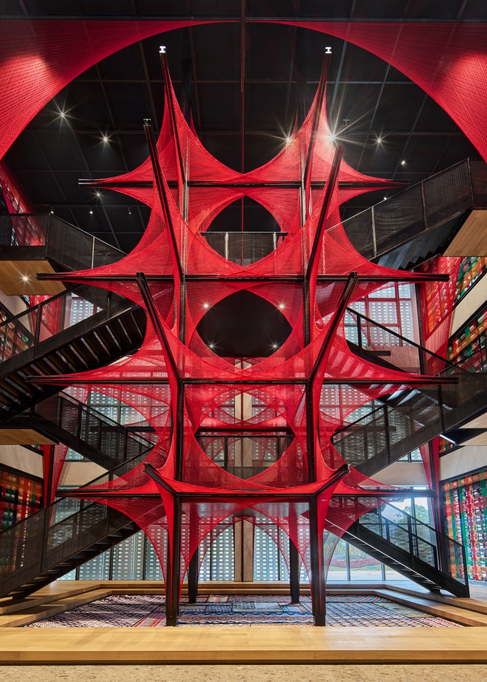 the flower of tujia at the china tujia brocade art museum by yimu design office