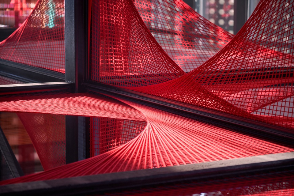 the flower of tujia at the china tujia brocade art museum by yimu design office
