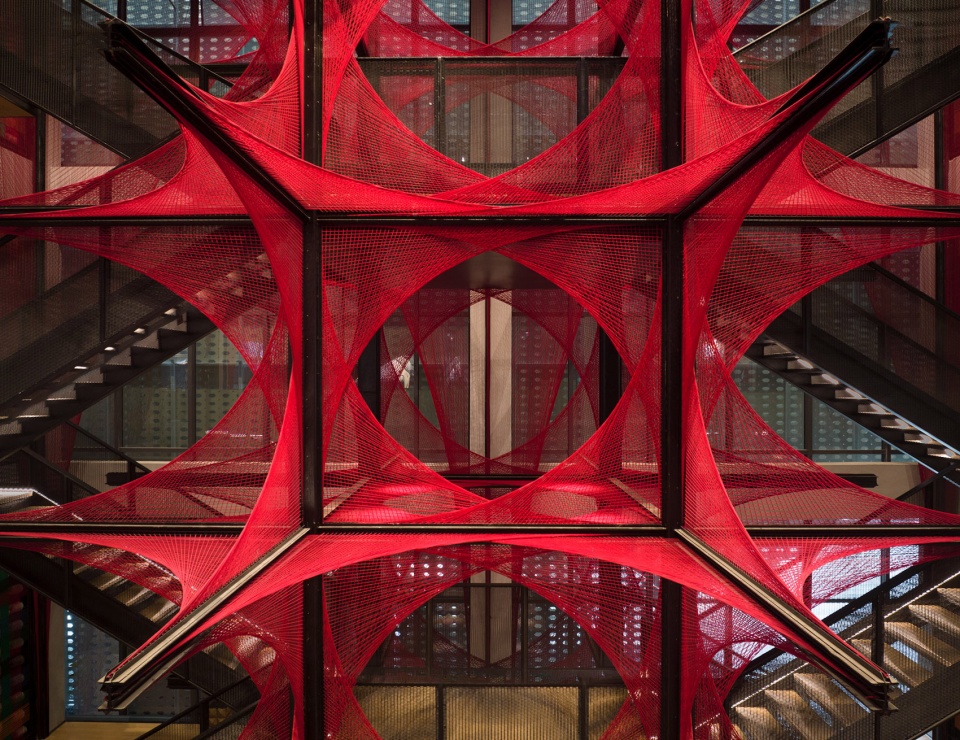 the flower of tujia at the china tujia brocade art museum by yimu design office