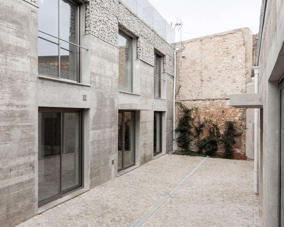 three exposed concrete facades by corpo atelier