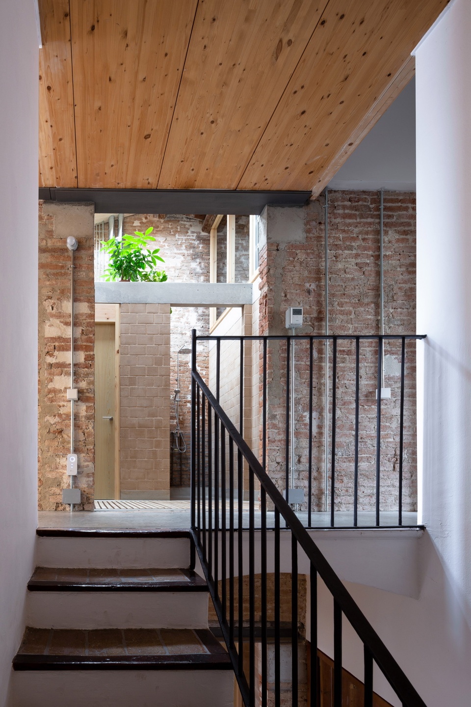 rehabilitation of two adjoining houses installation by arqbag
