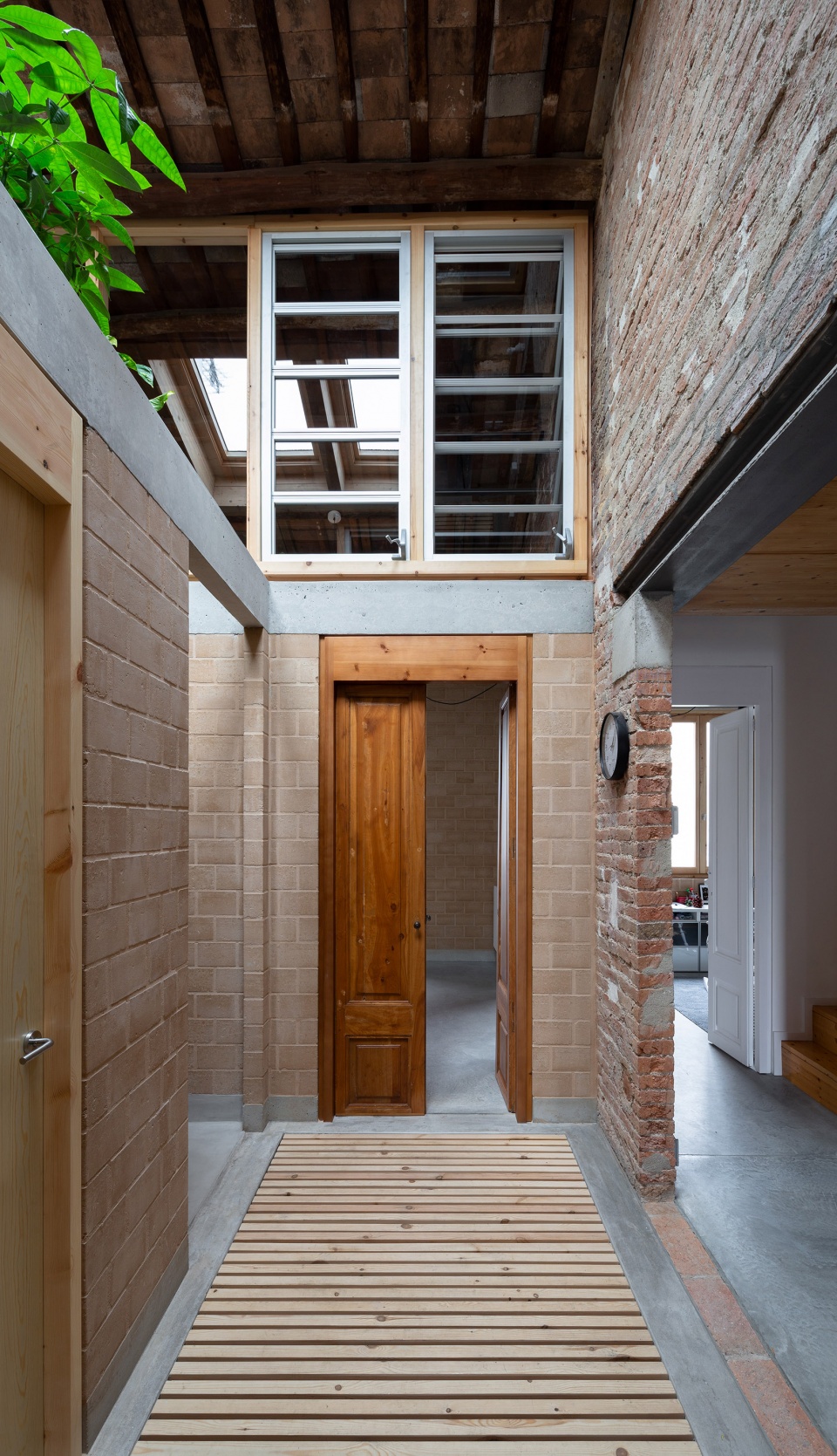 rehabilitation of two adjoining houses installation by arqbag