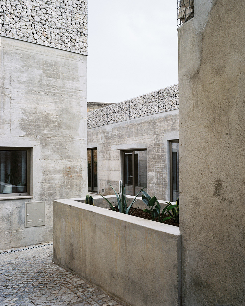 three exposed concrete facades by corpo atelier