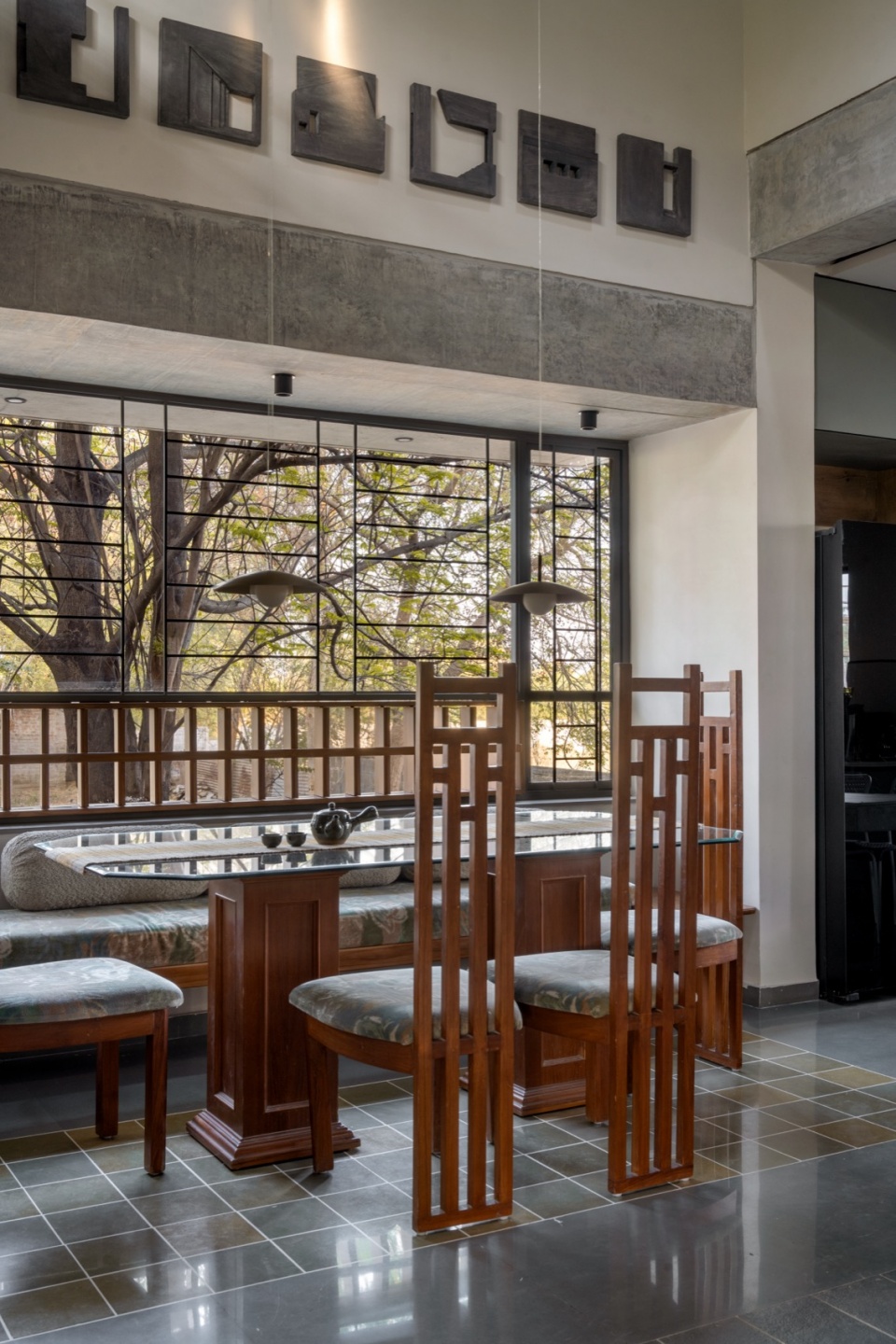 dining artwork done inhouse about facets of the building itself terra kota house by terra firma architects