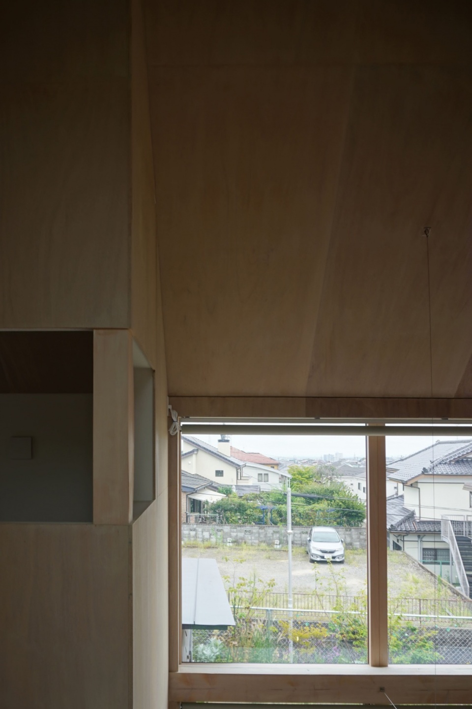 house with cross shaped earthen floor by fukei design