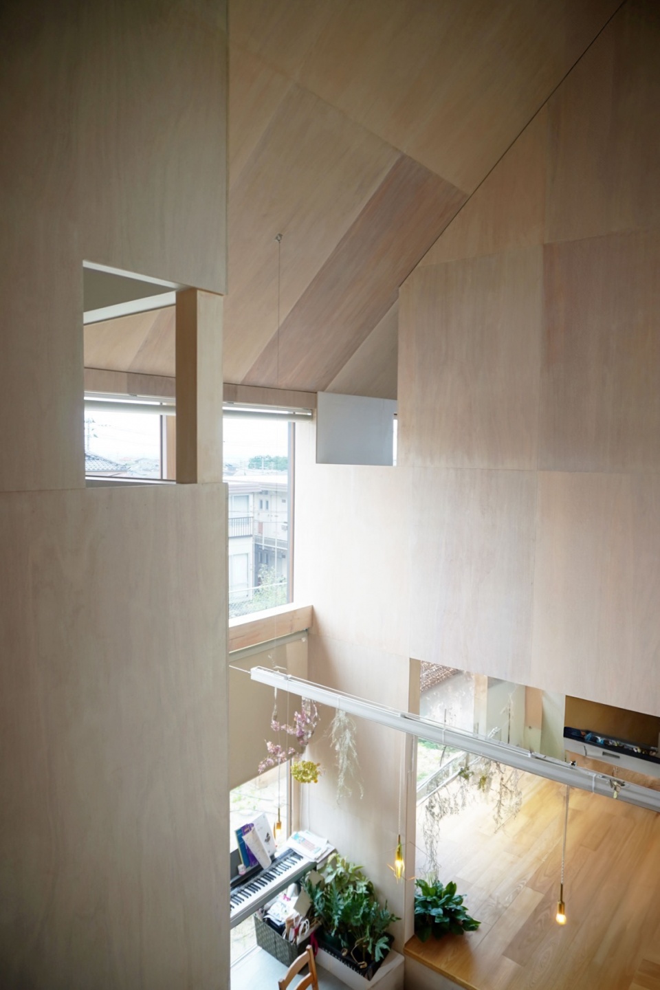 house with cross shaped earthen floor by fukei design