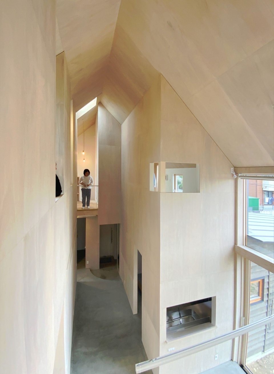 house with cross shaped earthen floor by fukei design