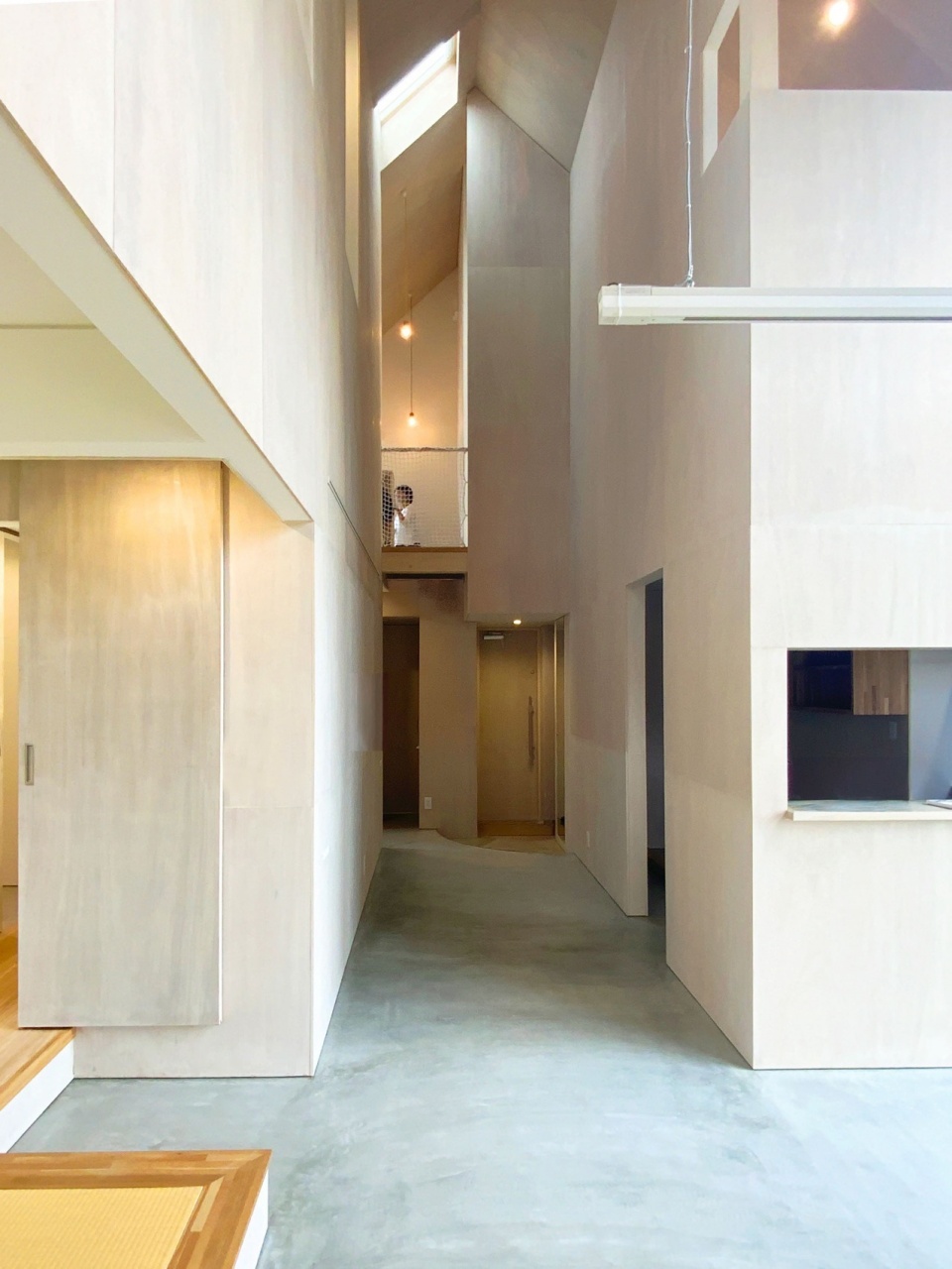 house with cross shaped earthen floor by fukei design