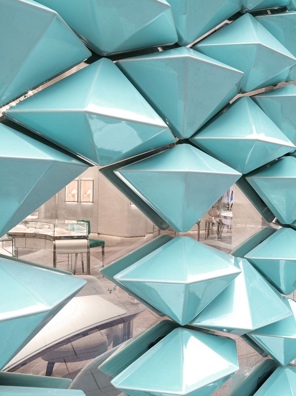 mvrdv designs facade of iridescent hand crafted ceramic diamonds for tiffany co store in stuttgart