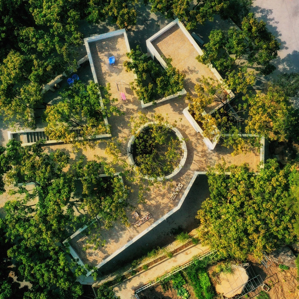 courtyard under longan trees by spacework architects