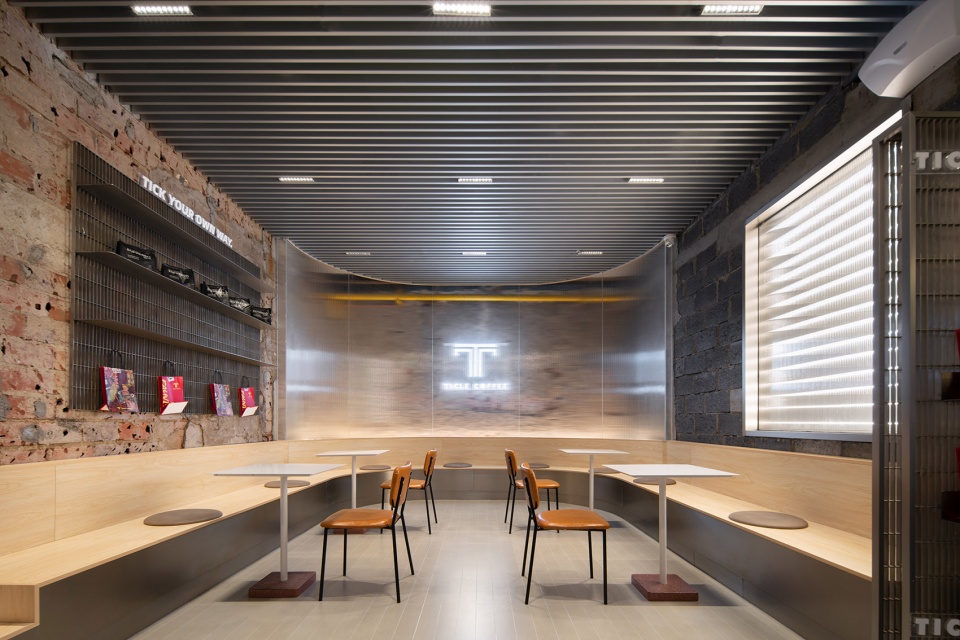 stainless steel and concrete intertwined ticle coffee series by daga architecture