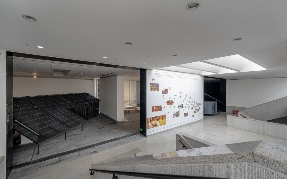 a settlement with sloping roofs exhibition design by atelier waterside