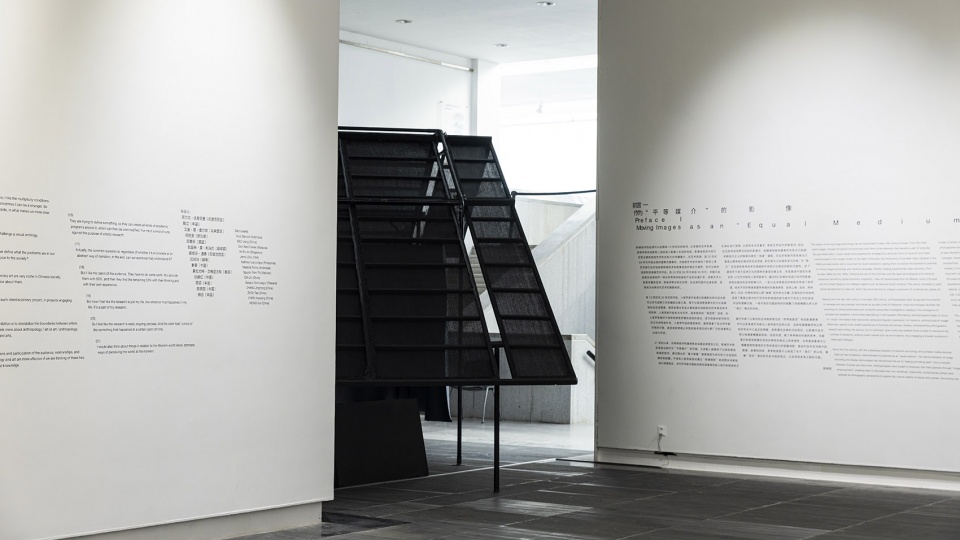 a settlement with sloping roofs exhibition design by atelier waterside