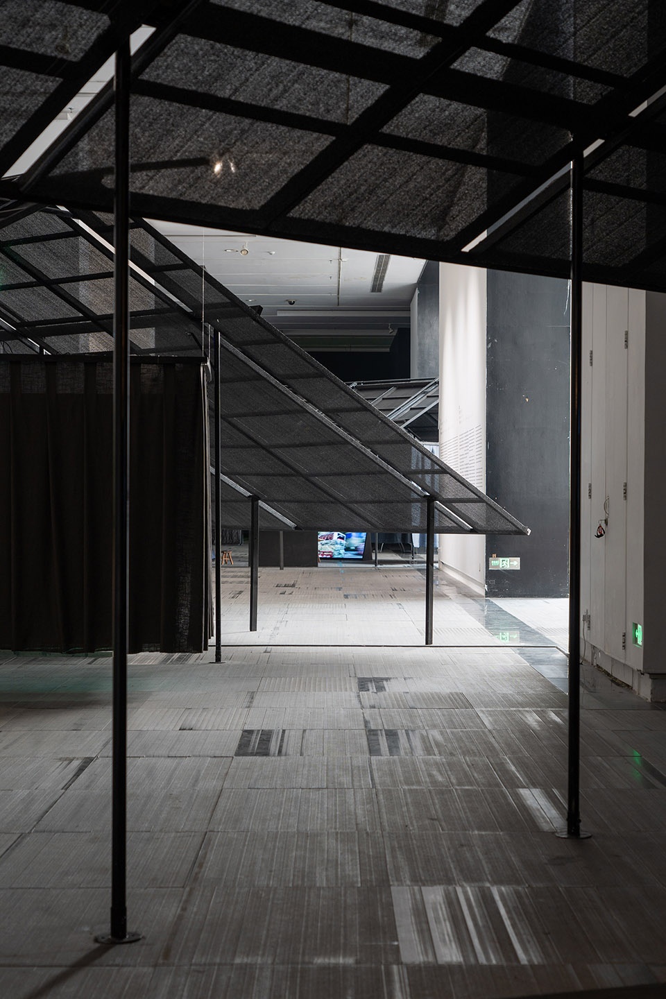 a settlement with sloping roofs exhibition design by atelier waterside