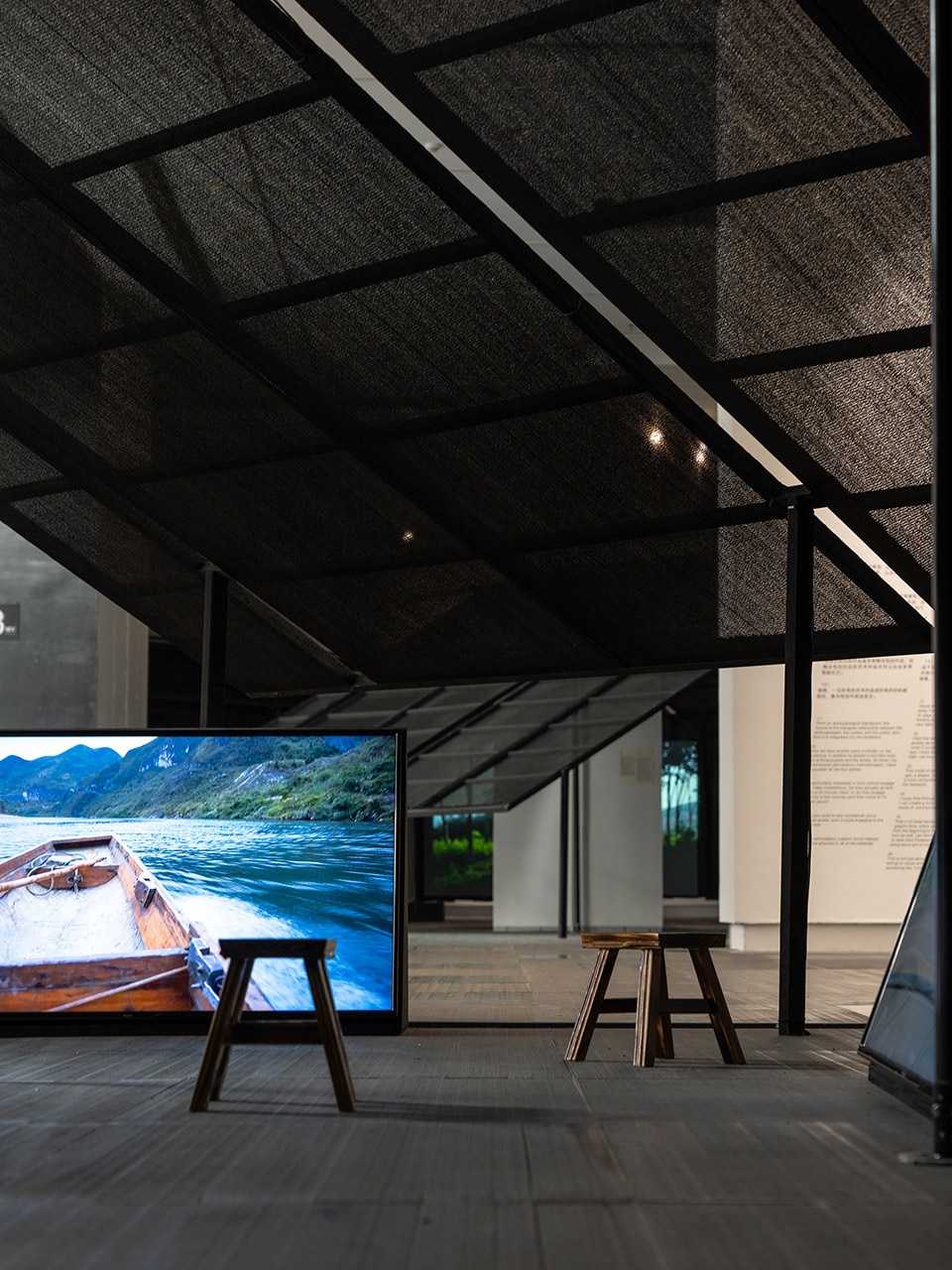 a settlement with sloping roofs exhibition design by atelier waterside