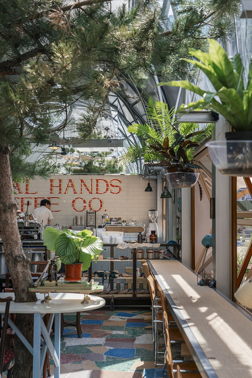 metal hands coffee youyi store by sa architects