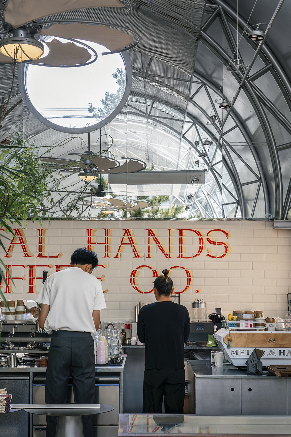 metal hands coffee youyi store by sa architects