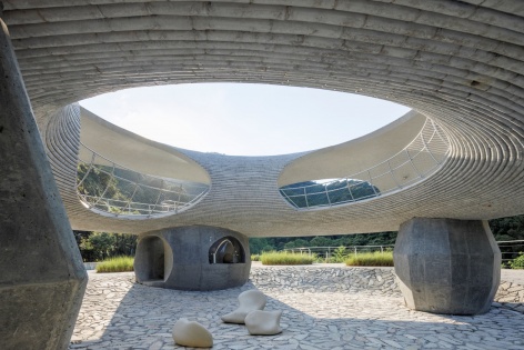 resting loop with views a creekside pavilion among hills by hcch studio