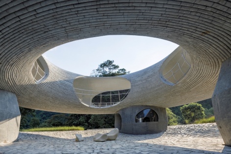 resting loop with views a creekside pavilion among hills by hcch studio