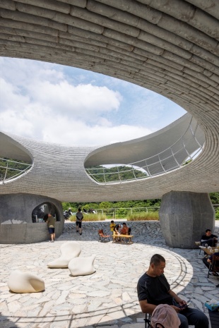 resting loop with views a creekside pavilion among hills by hcch studio
