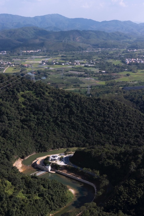resting loop with views a creekside pavilion among hills by hcch studio