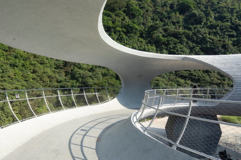 resting loop with views a creekside pavilion among hills by hcch studio