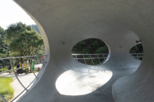 resting loop with views a creekside pavilion among hills by hcch studio