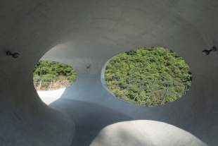 resting loop with views a creekside pavilion among hills by hcch studio