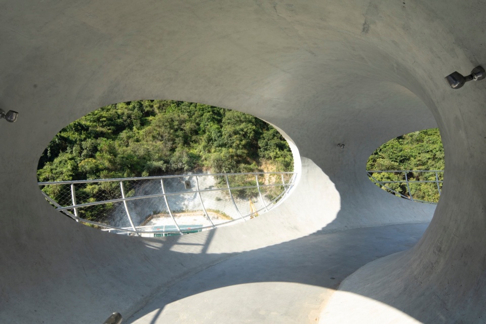 resting loop with views a creekside pavilion among hills by hcch studio
