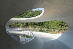 resting loop with views a creekside pavilion among hills by hcch studio
