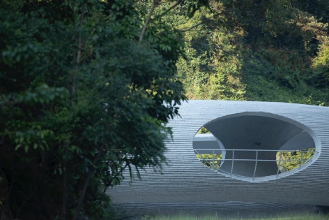 resting loop with views a creekside pavilion among hills by hcch studio