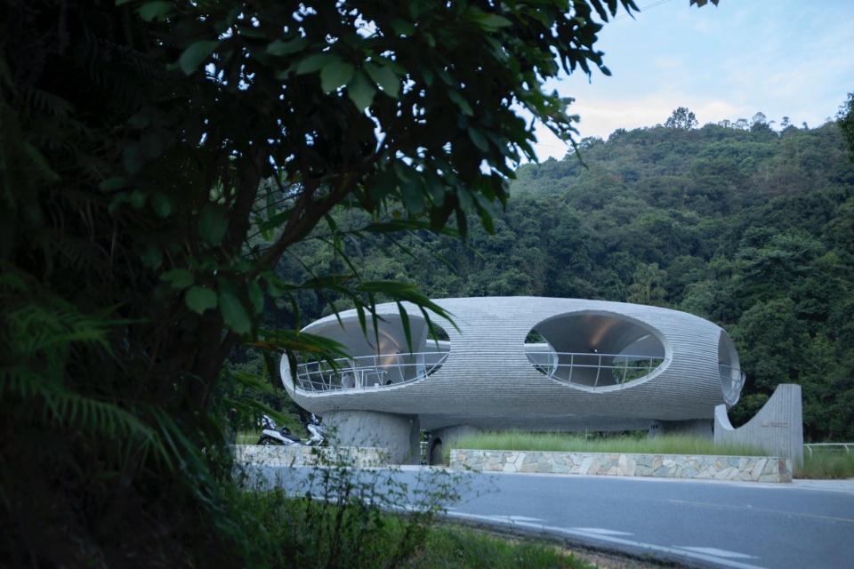 resting loop with views a creekside pavilion among hills by hcch studio