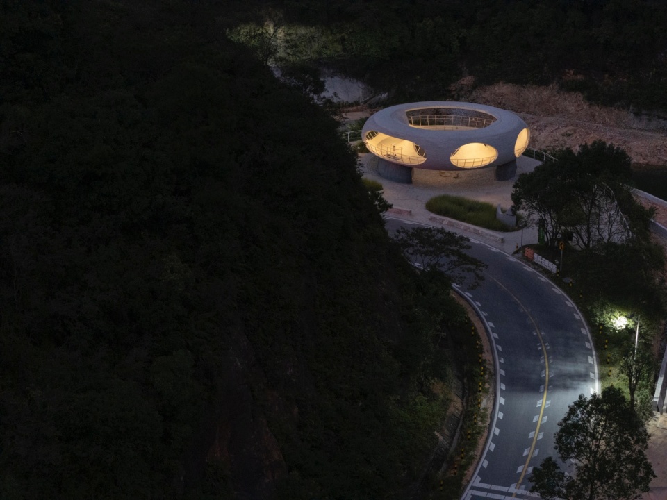 resting loop with views a creekside pavilion among hills by hcch studio