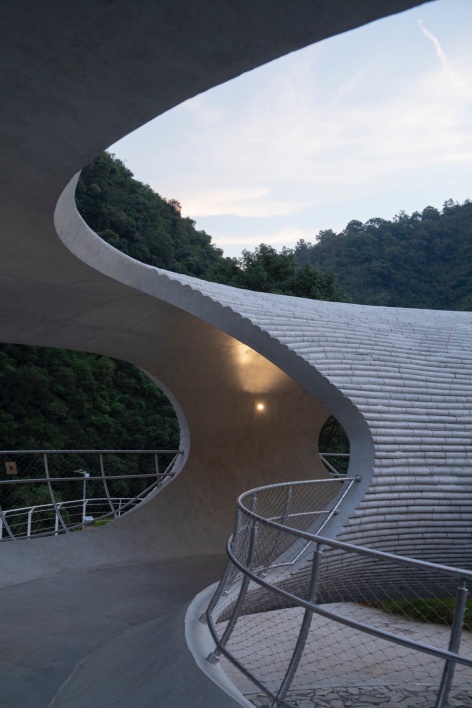 resting loop with views a creekside pavilion among hills by hcch studio