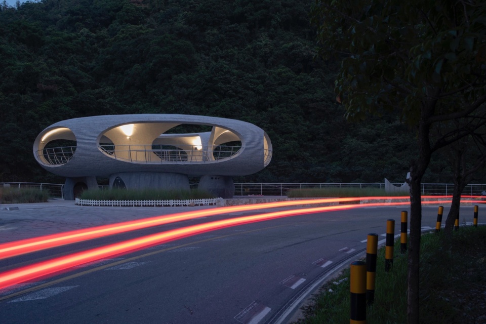 resting loop with views a creekside pavilion among hills by hcch studio