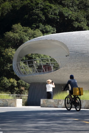 resting loop with views a creekside pavilion among hills by hcch studio